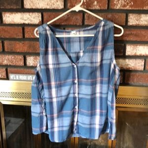 Buttoned down sleeveless blouse.